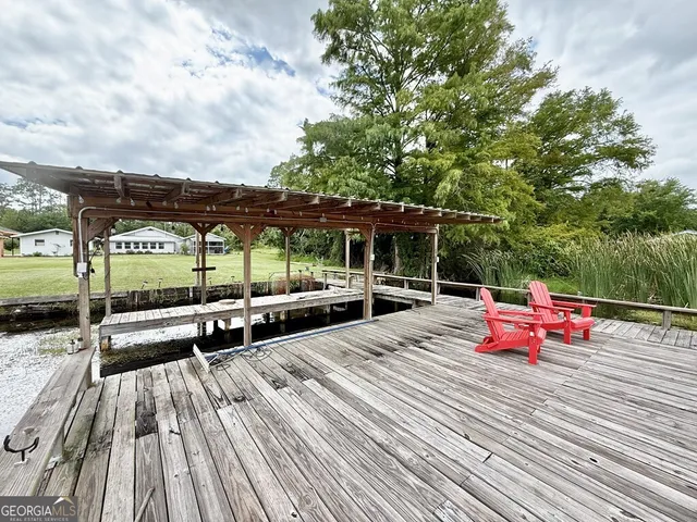 a view of swimming pool with outdoor seating