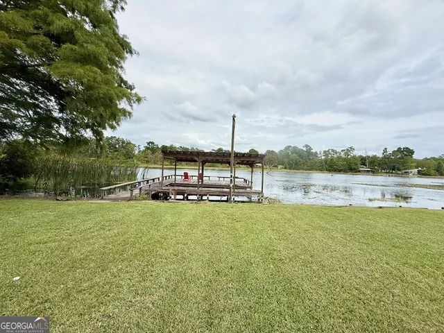 a view of a large yard with a large trees