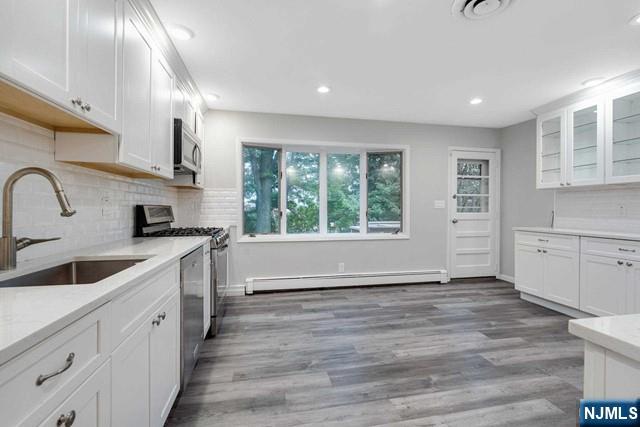 32 Rock Road Englewood Cliffs, NJ 07632 - Photo 7 of 30 a kitchen with a sink cabinets and window