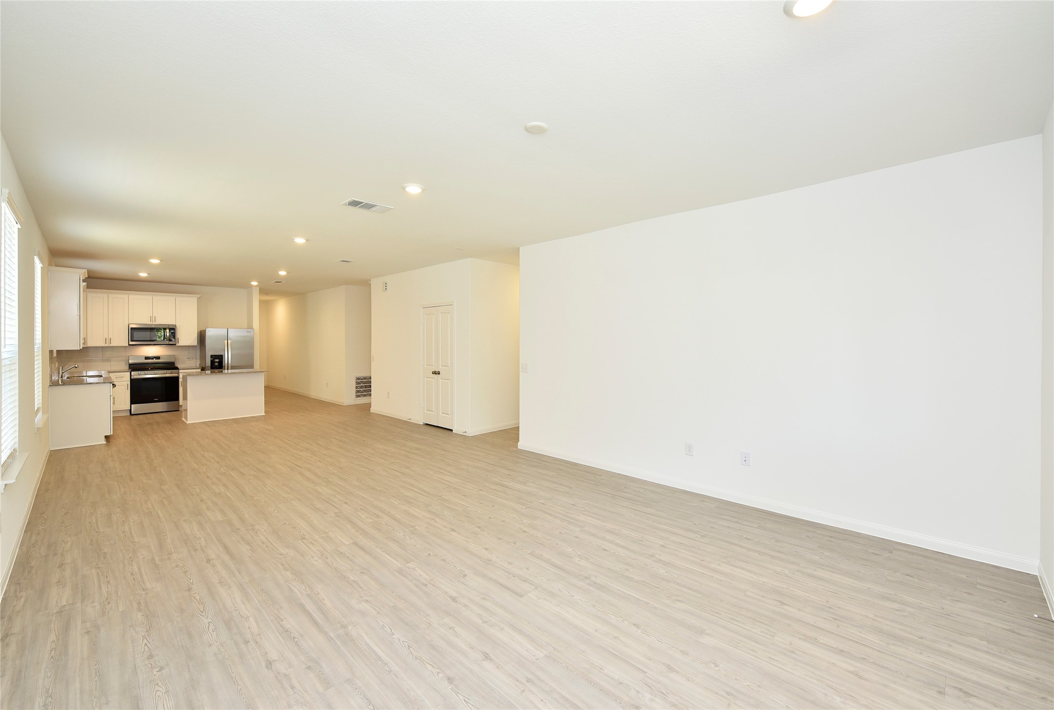 25473 Cilantro Drive Magnolia, TX 77355 - Photo 5 of 21 Here’s another look at the bright and spacious family room open to the kitchen and dining area—notice the natural light and open design.