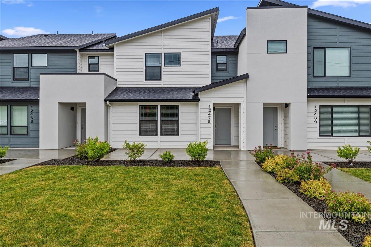12475 West Victory Road Boise, ID 83709 - Photo 1 of 26 Modern multi-story facade featuring mixed-material siding and a contrasting roofline