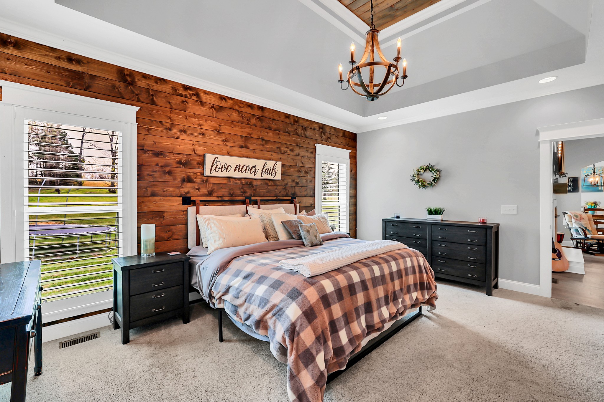 3190 Belotes Ferry Road Lebanon, TN 37087 - Photo 30 of 59 a bedroom with a bed and a chandelier