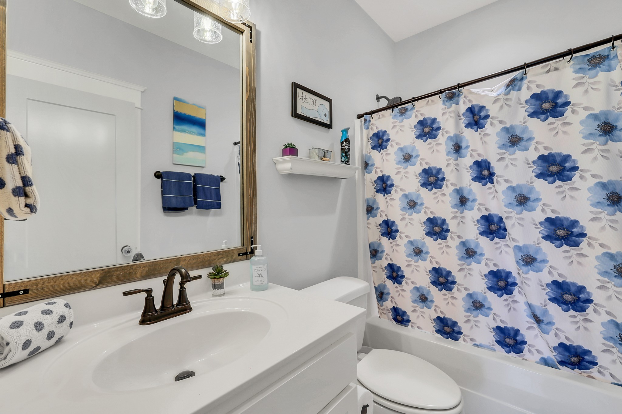 3190 Belotes Ferry Road Lebanon, TN 37087 - Photo 34 of 59 a bathroom with a sink toilet and shower