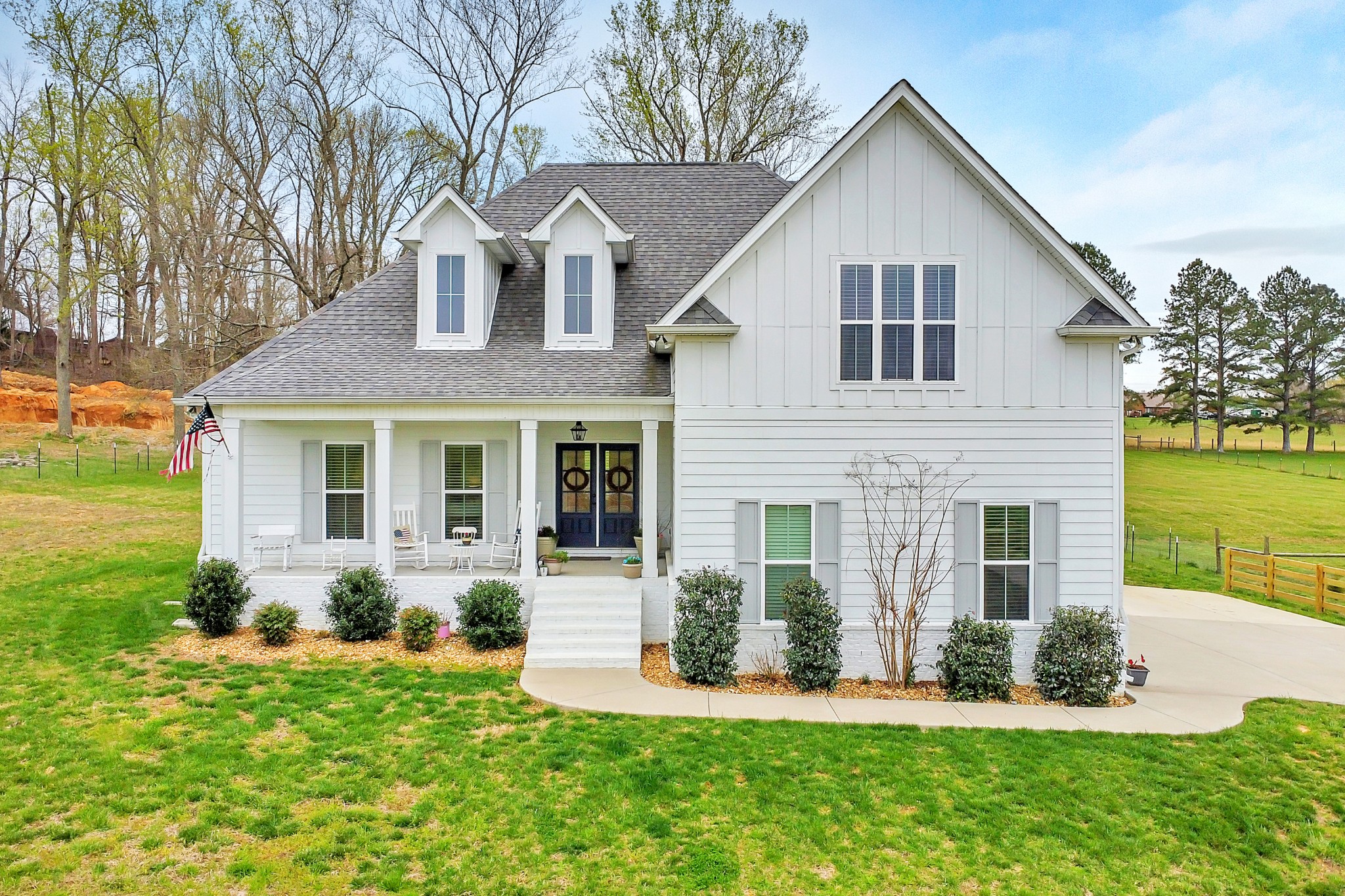 3190 Belotes Ferry Road Lebanon, TN 37087 - Photo 8 of 59 a front view of a house with a yard and potted plants
