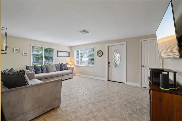 a living room with furniture and a window
