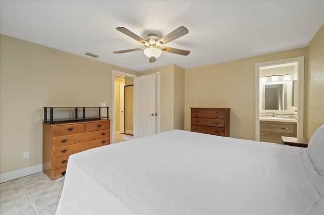 a bedroom with a bed and a dresser