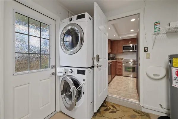 a view of a kitchen with washer and dryer