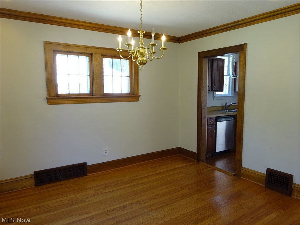 971 Roanoke Road Cleveland, OH 44121 - Photo 4 of 19 Formal dining room has more natural woodwork and lots of light.