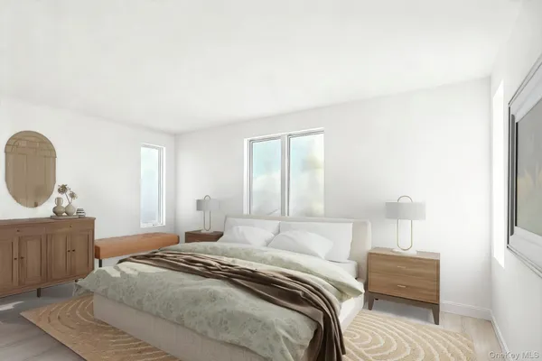 a bedroom with a bed a dresser and chair