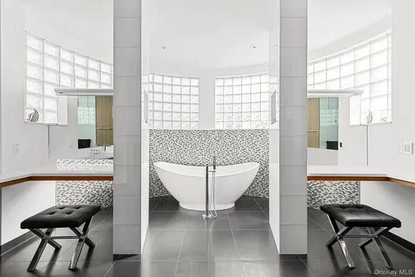 a living room with furniture and a bathtub