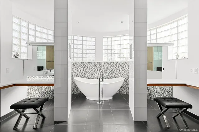 a living room with furniture and a bathtub