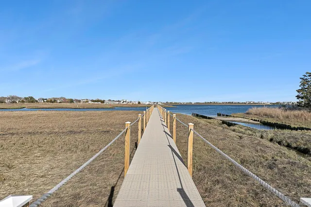 a view of ocean with a building in the background
