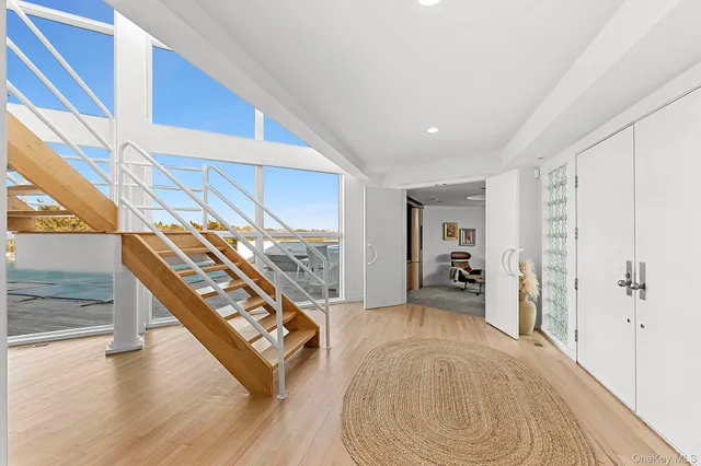 a view of an entryway with wooden floor