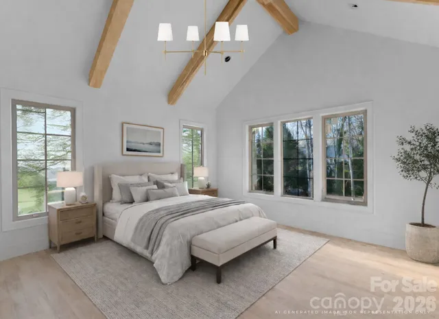 a bedroom with a large bed and a large window