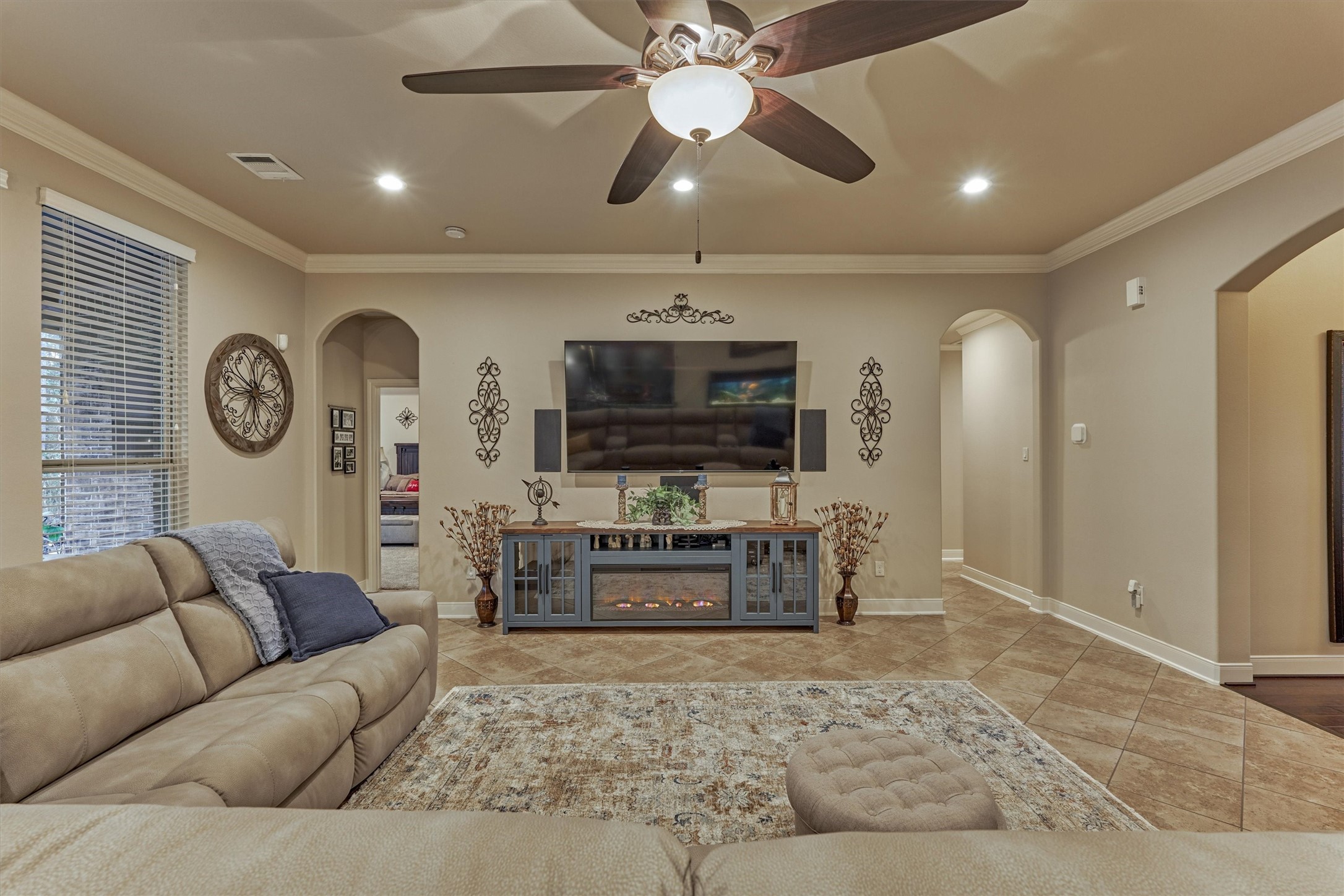 11598 Sebastian's Run Montgomery, TX 77316 - Photo 14 of 50 Spacious living area featuring a cozy layout and seamless flow to the primary suite and secondary bedrooms and half bath.