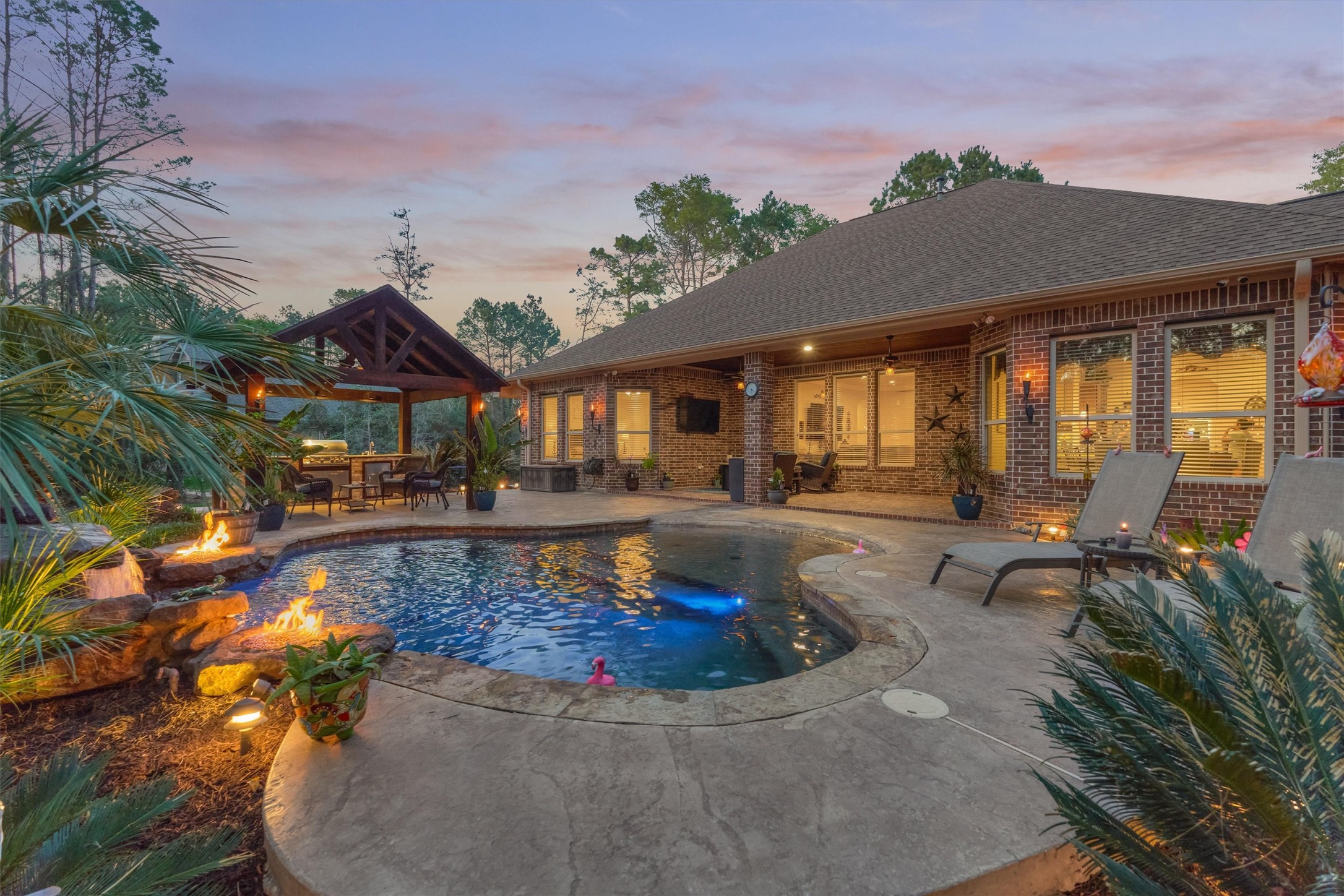 11598 Sebastian's Run Montgomery, TX 77316 - Photo 2 of 50 Resort-style backyard designed for entertaining with pool and outdoor features. Pay attention to the gorgeous fire features.