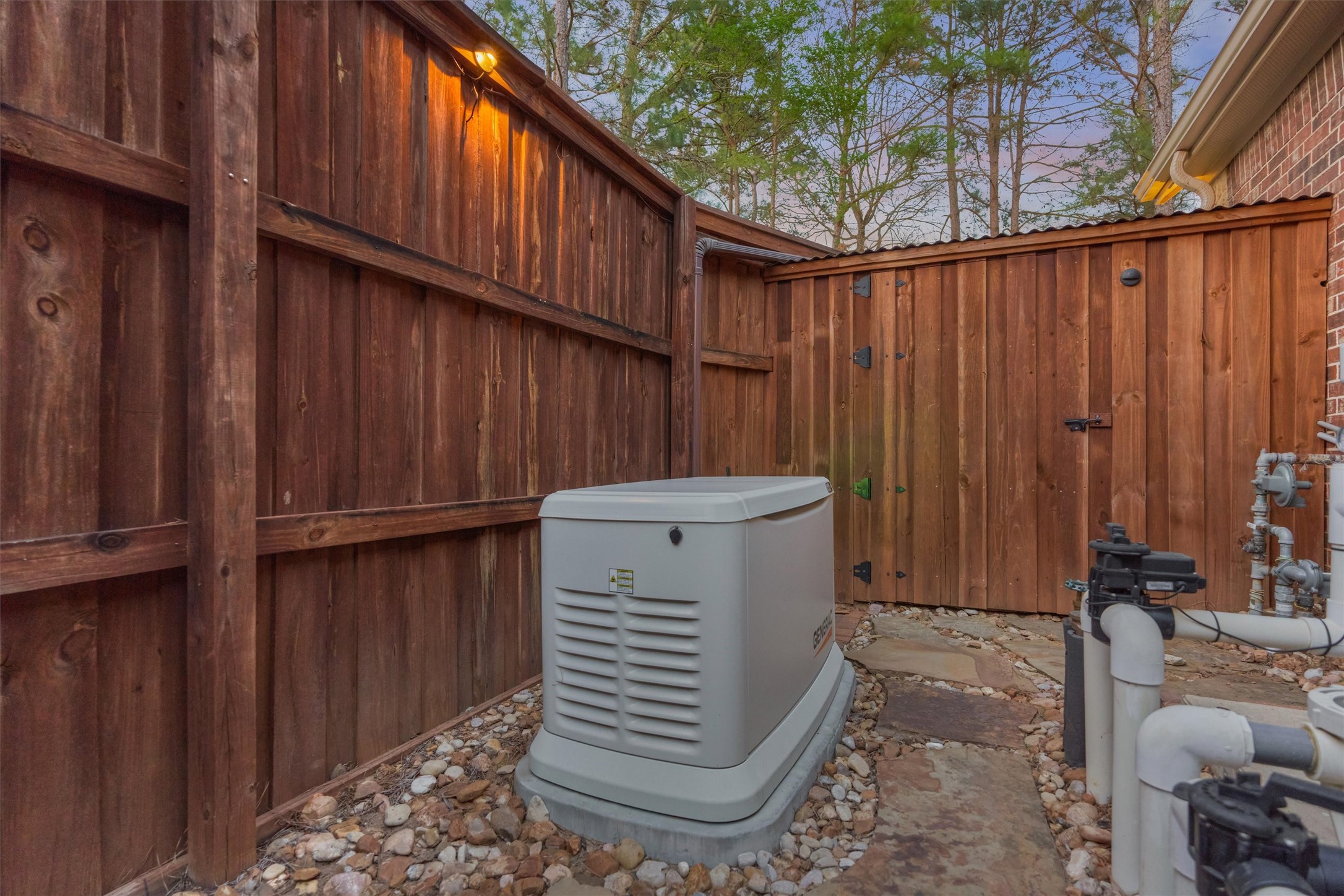 11598 Sebastian's Run Montgomery, TX 77316 - Photo 38 of 50 26kW automatic backup generator for added peace of mind. The water softener is in the enclosed room past generator and pool equipment