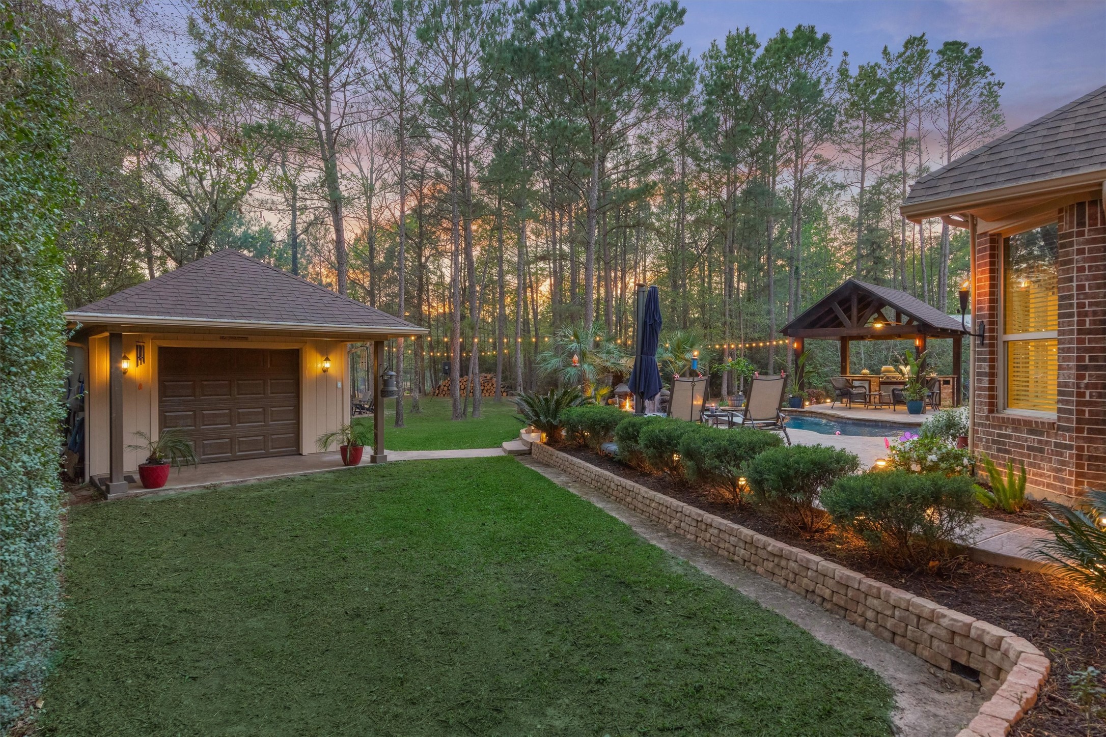 11598 Sebastian's Run Montgomery, TX 77316 - Photo 41 of 50 Well-maintained grounds with lush landscaping and walkway to outbuilding.