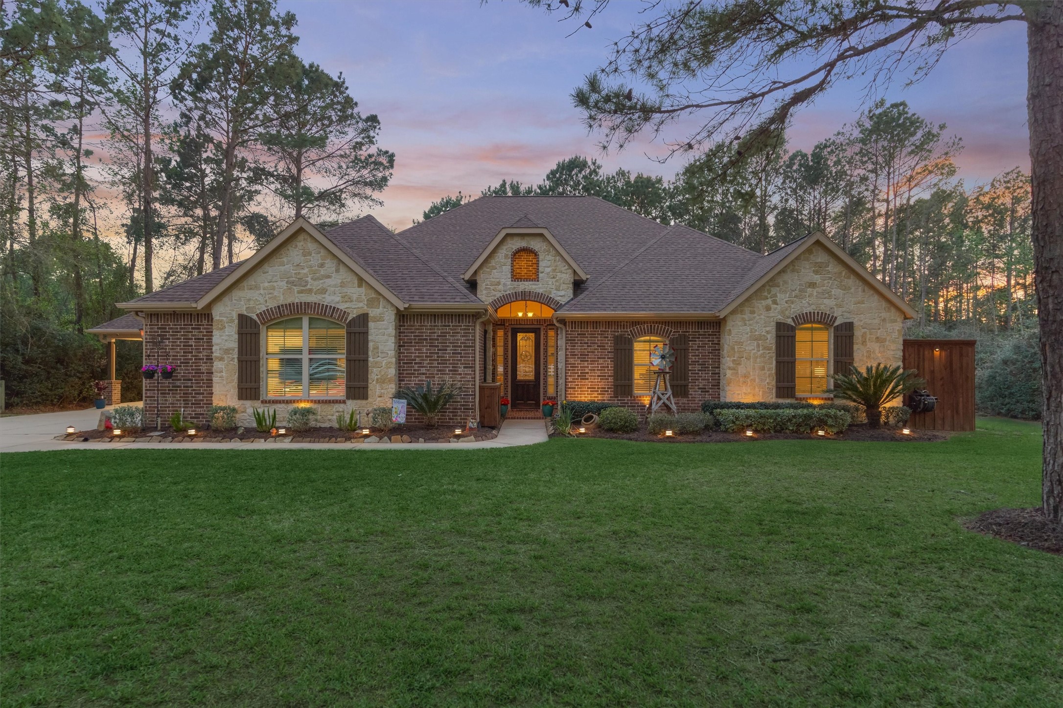 11598 Sebastian's Run Montgomery, TX 77316 - Photo 46 of 50 Stunning evening view showcasing the home's elegant exterior lighting.