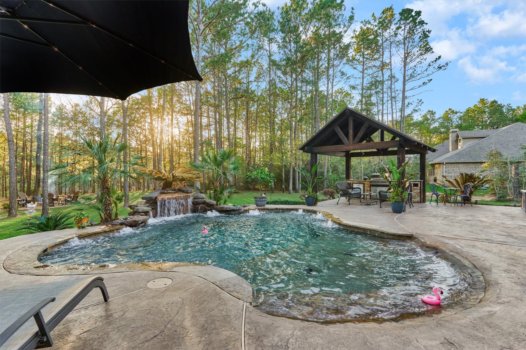 11598 Sebastian's Run Montgomery, TX 77316 - Photo 7 of 50 Relax around the pool (spa/hottub) area featuring built-in seating around the perimeter. The depth range from 18 to 22 inches deep to accommodate all sizes of people. The entire middle is 4 ft with a beach entry and steps.