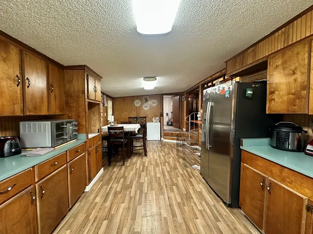 a kitchen with lots of counter top space and stainless steel appliances