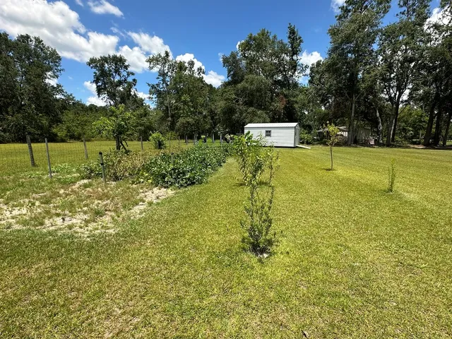 a view of a house with a big yard