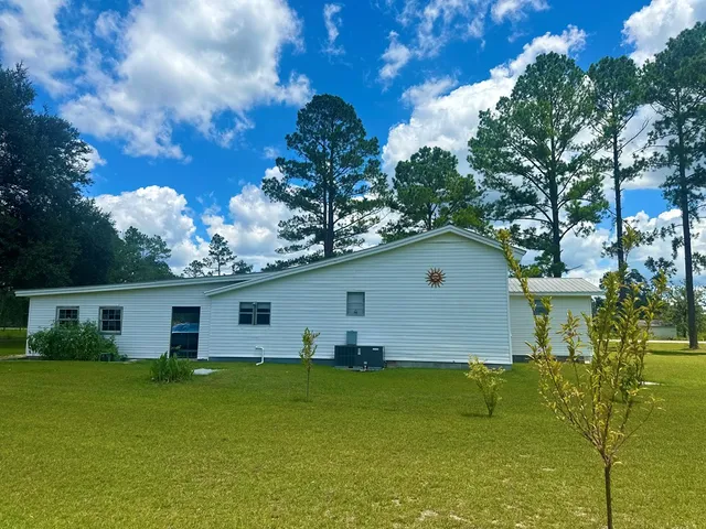 a swimming pool with trees in the background