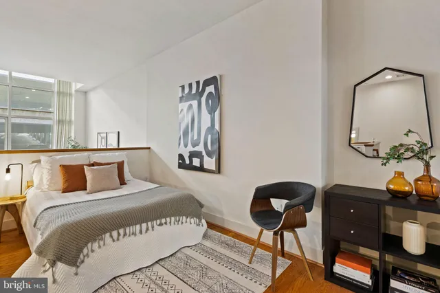 a bedroom with a bed and window