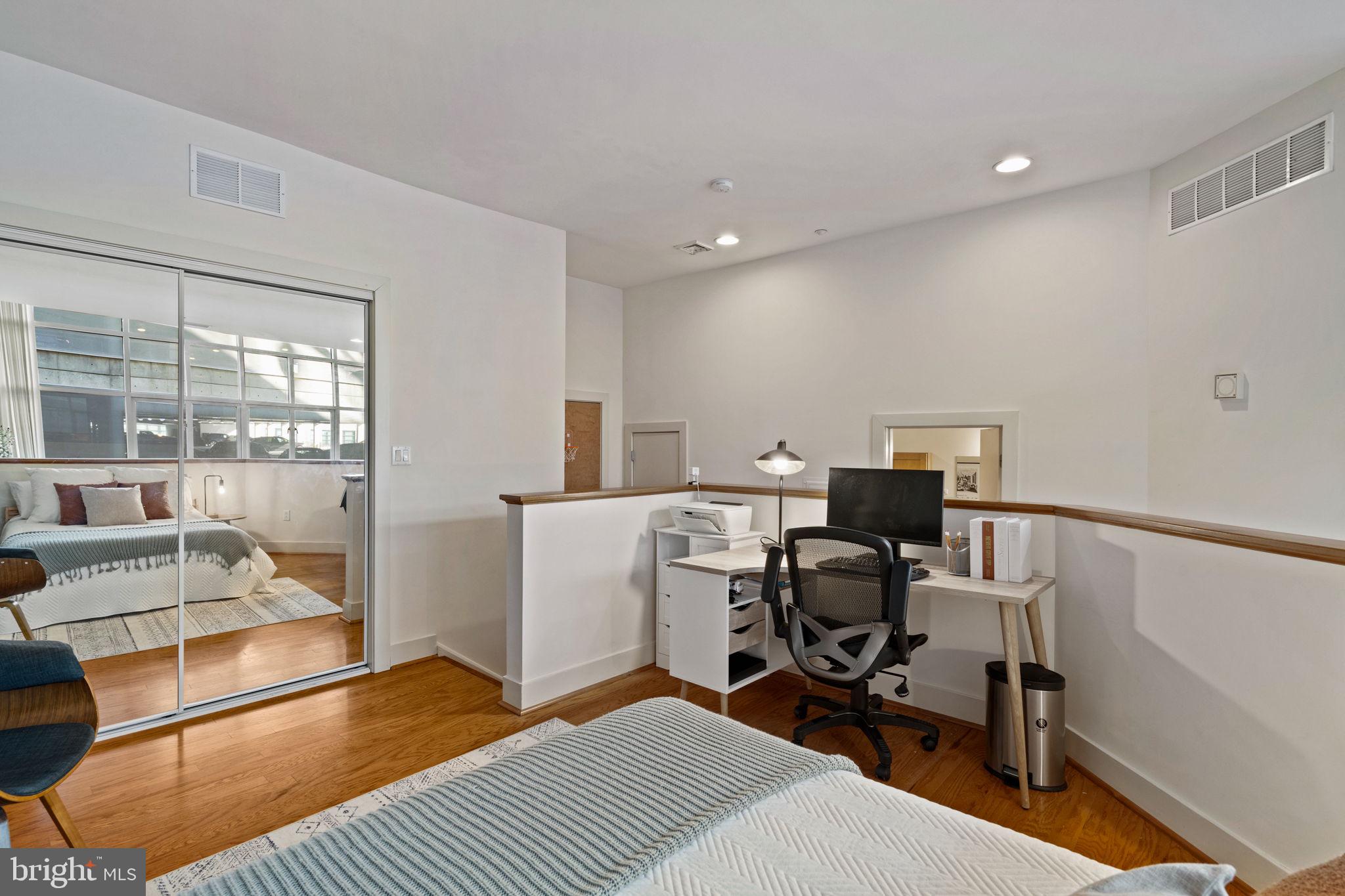 23 South 23rd Street, Unit 3D Philadelphia, PA 19103 - Photo 26 of 37 a view of a workspace with furniture and a window