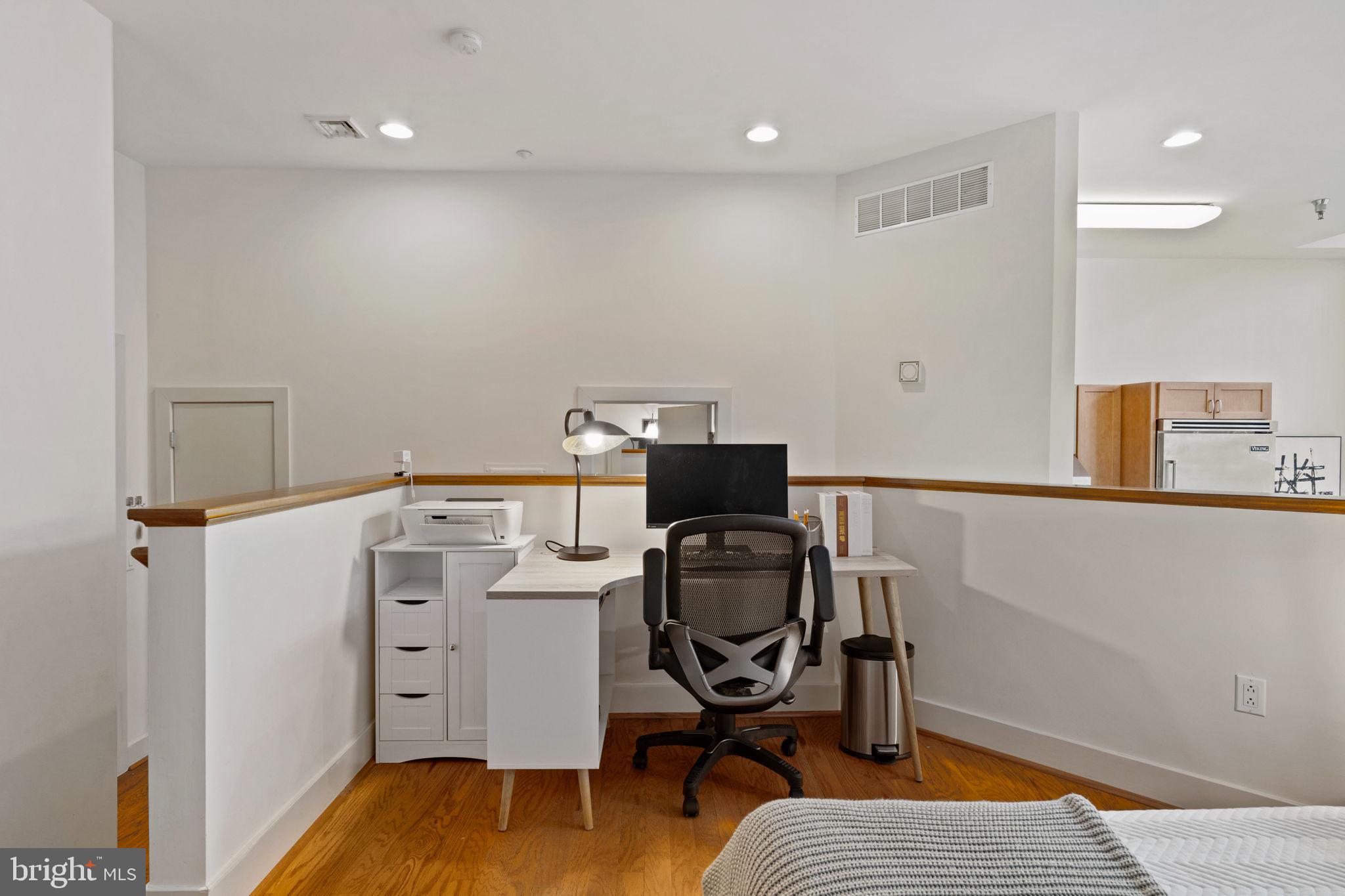 23 South 23rd Street, Unit 3D Philadelphia, PA 19103 - Photo 27 of 37 a view of workspace with wooden floor
