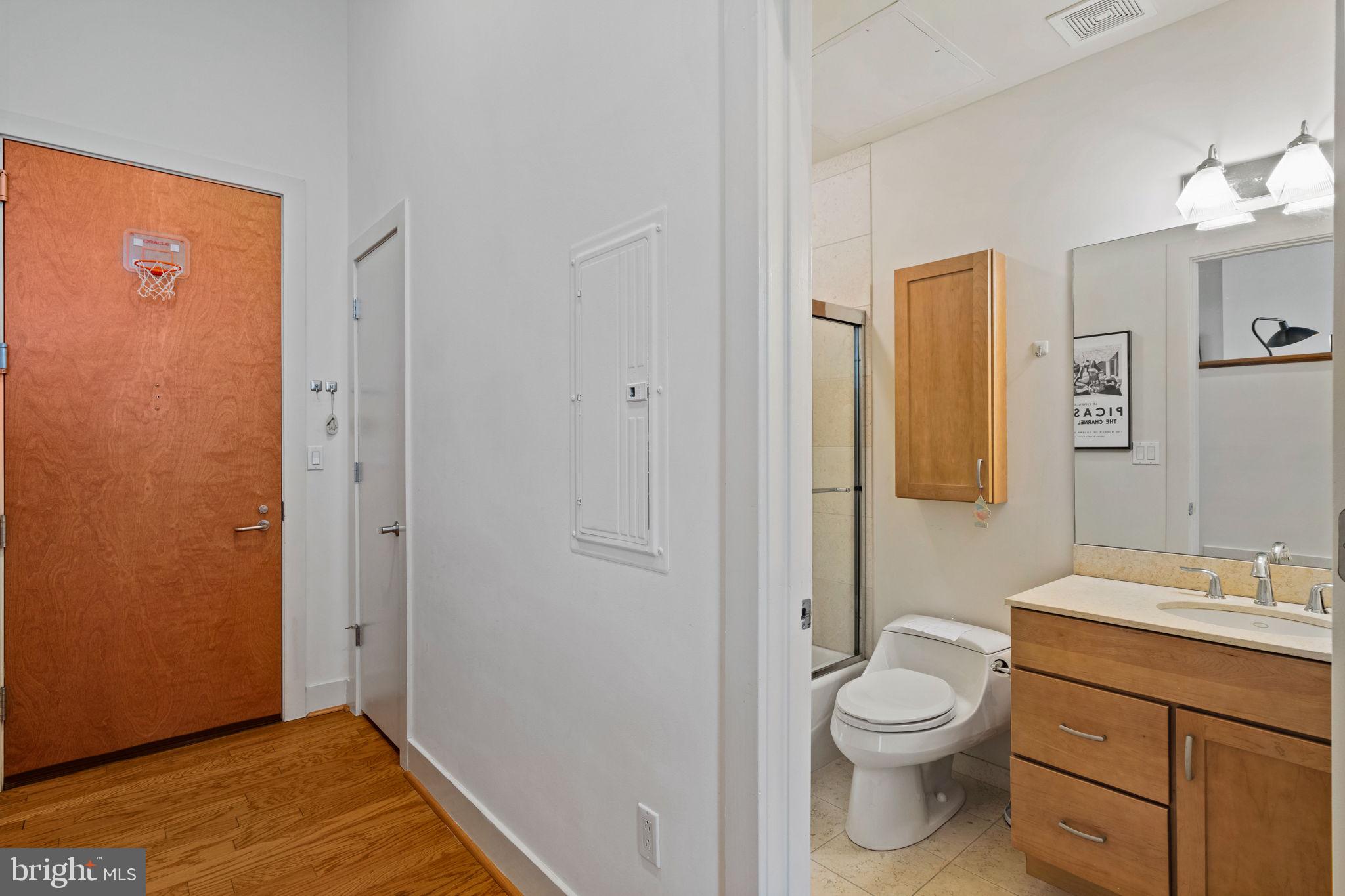 23 South 23rd Street, Unit 3D Philadelphia, PA 19103 - Photo 28 of 37 a bathroom with a toilet a sink and a mirror