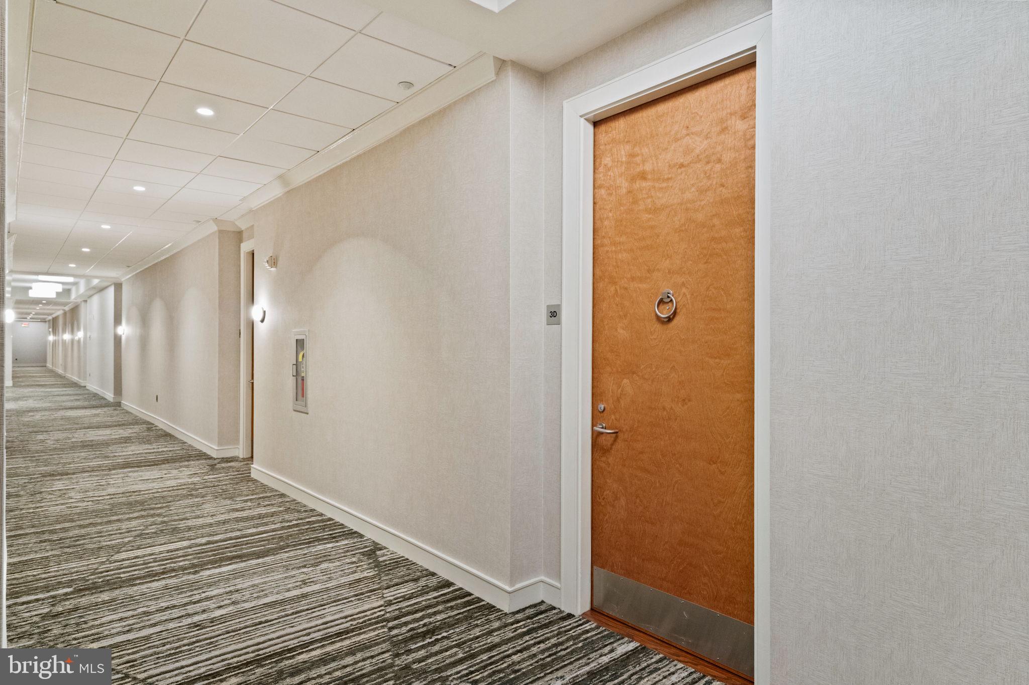23 South 23rd Street, Unit 3D Philadelphia, PA 19103 - Photo 31 of 37 a view of a hallway with wooden floor
