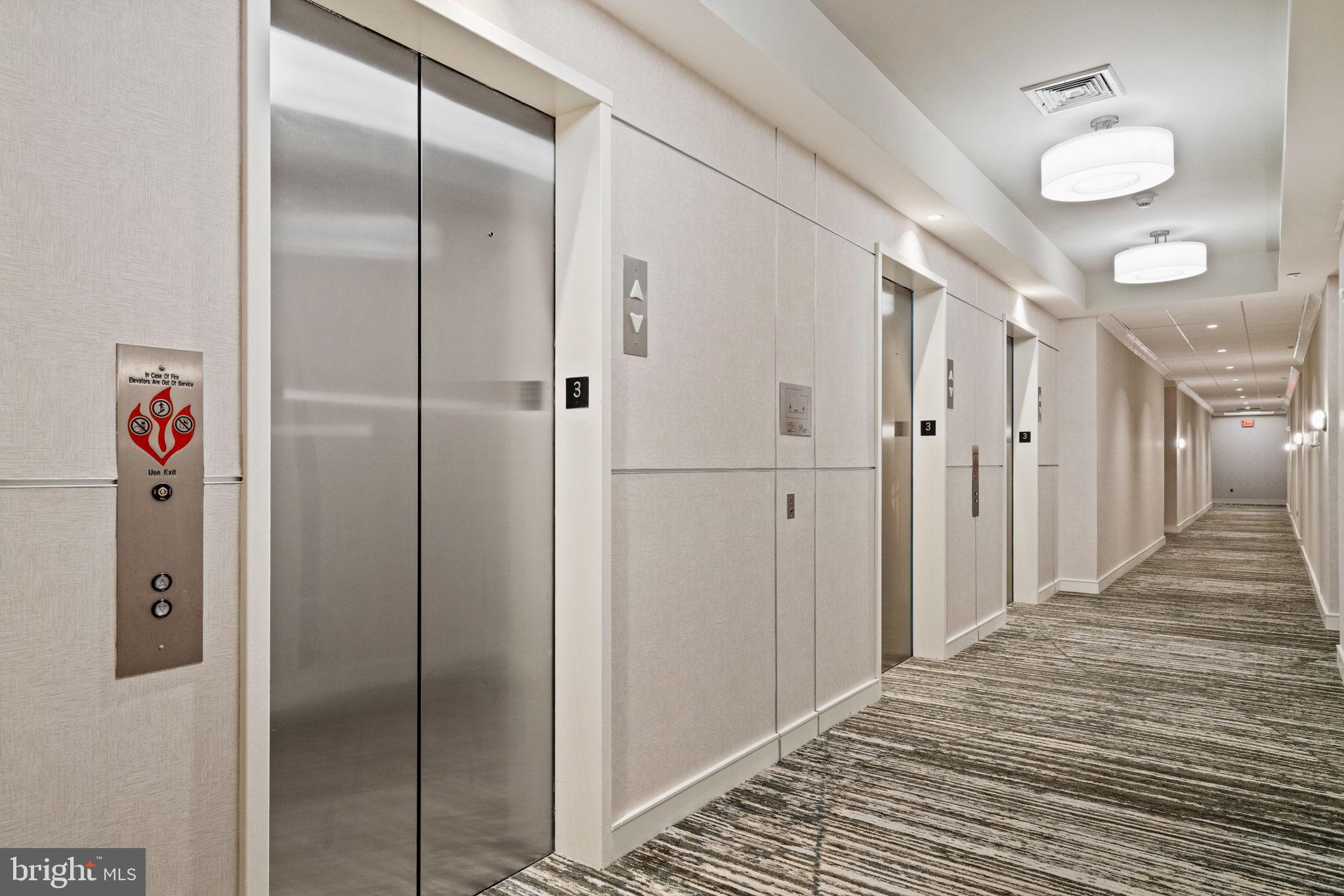 23 South 23rd Street, Unit 3D Philadelphia, PA 19103 - Photo 32 of 37 a view of a hallway with stainless steel appliances wooden floor and closet area