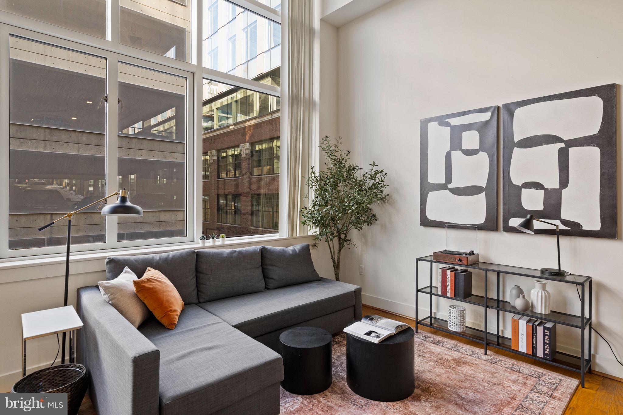 23 South 23rd Street, Unit 3D Philadelphia, PA 19103 - Photo 6 of 37 a living room with furniture