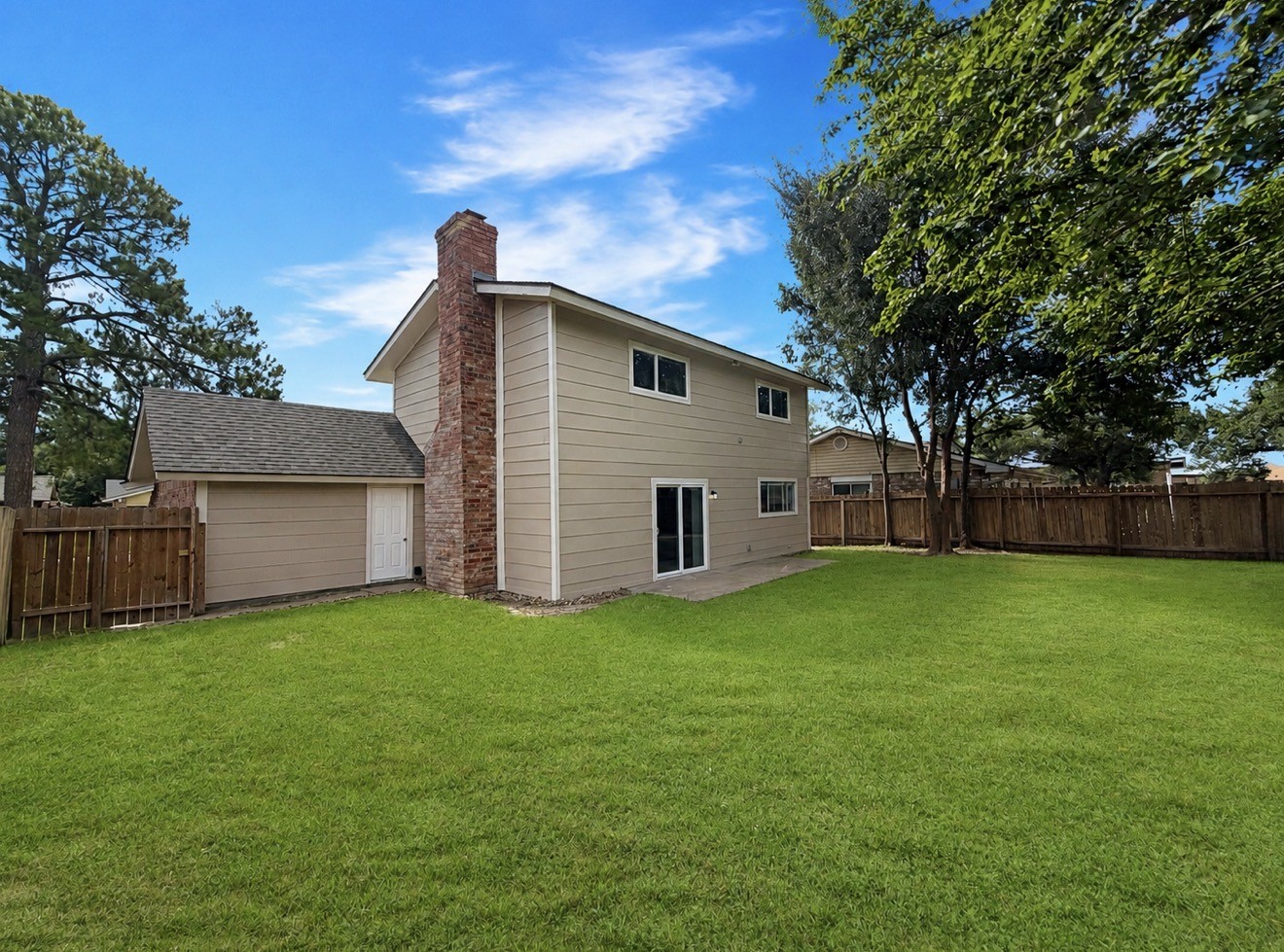 8407 Riverside Walk Lane Houston, TX 77064 - Photo 13 of 33 Expansive backyard offers endless possibilities for outdoor living, play, gardening, or even a future pool, all surrounded by mature trees for added privacy. Additional back door access to garage.