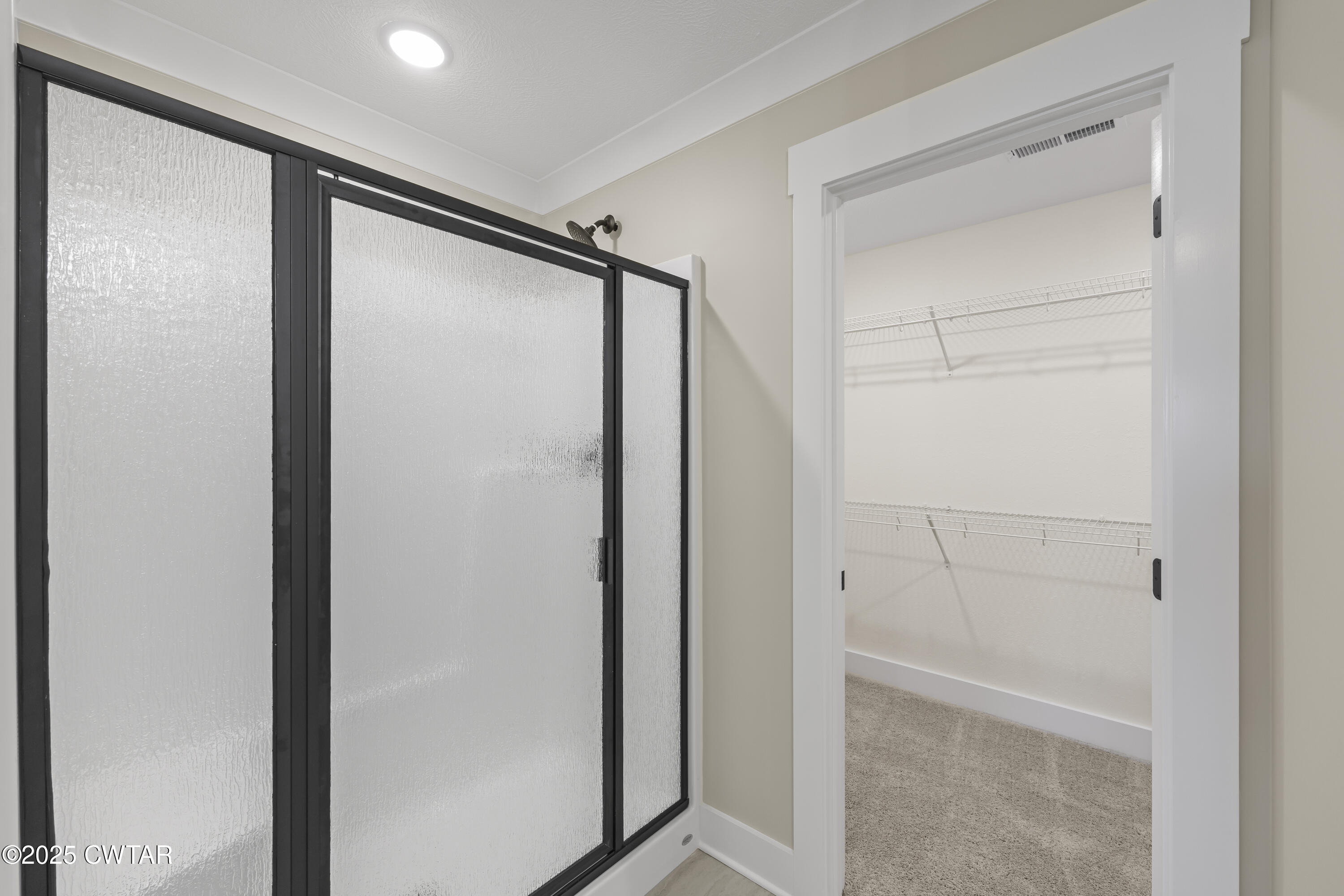 5 Easington Cove Jackson, TN 38305 - Photo 13 of 17 a bathroom with a glass shower door and a sink