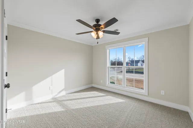 a view of an empty room with a window