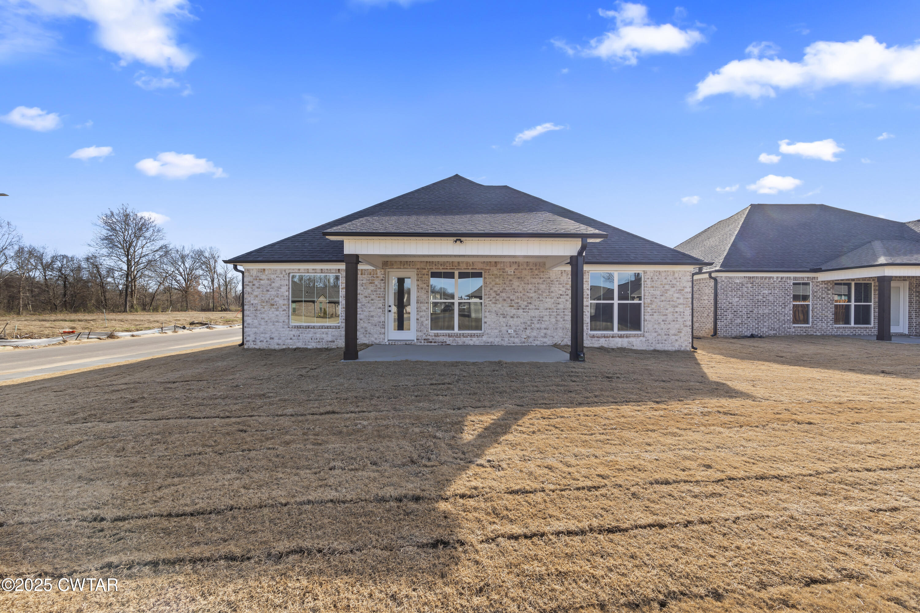 5 Easington Cove Jackson, TN 38305 - Photo 2 of 17 a front view of a house with a yard