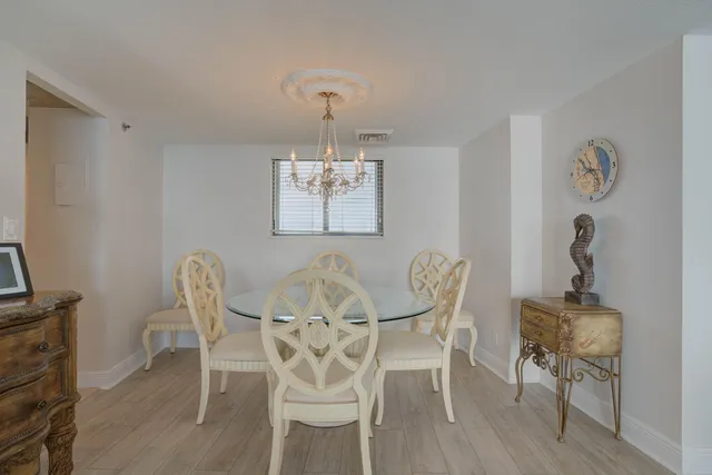 a bedroom with a bed and large window