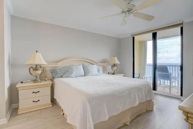 a bedroom with a bed and chair