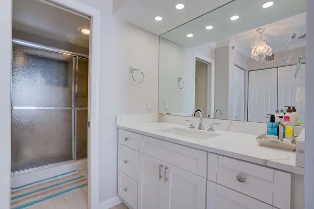 a bathroom with a glass shower door