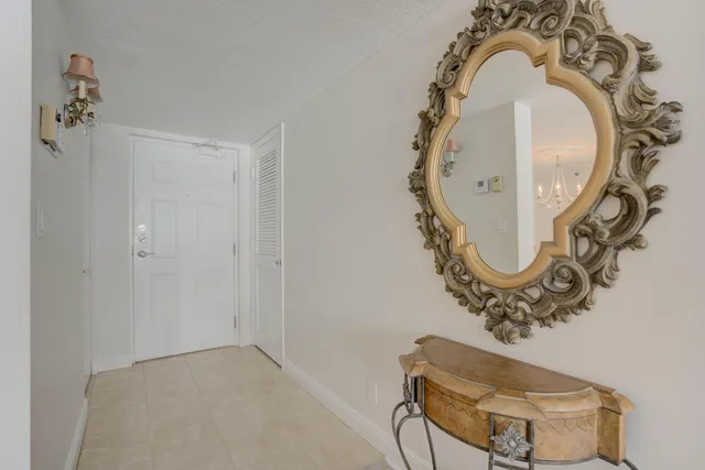 a bathroom with a mirror and shower in it