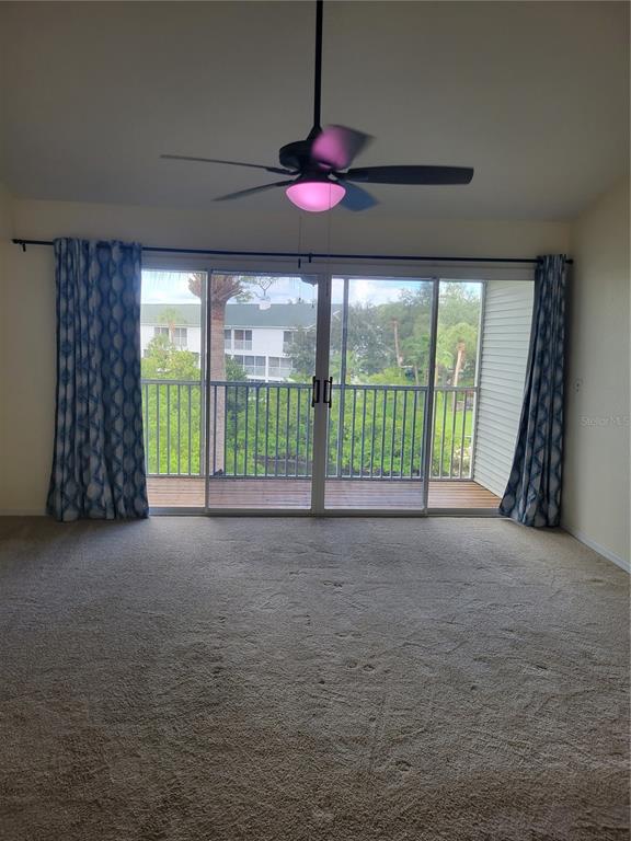 9976 Indian Key Trail, Unit 7 Seminole, FL 33776 - Photo 11 of 16 a view of empty room with floor to ceiling window