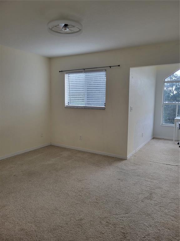 9976 Indian Key Trail, Unit 7 Seminole, FL 33776 - Photo 13 of 16 an empty room with windows