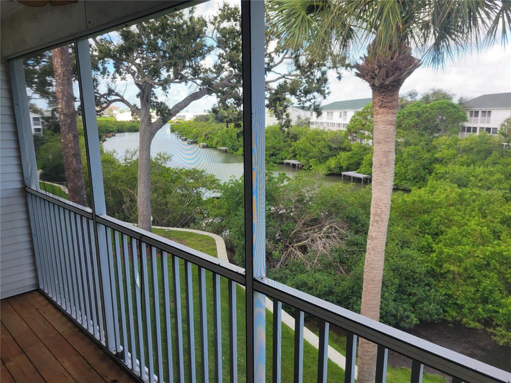 9976 Indian Key Trail, Unit 7 Seminole, FL 33776 - Photo 6 of 16 a view of a garden from a balcony