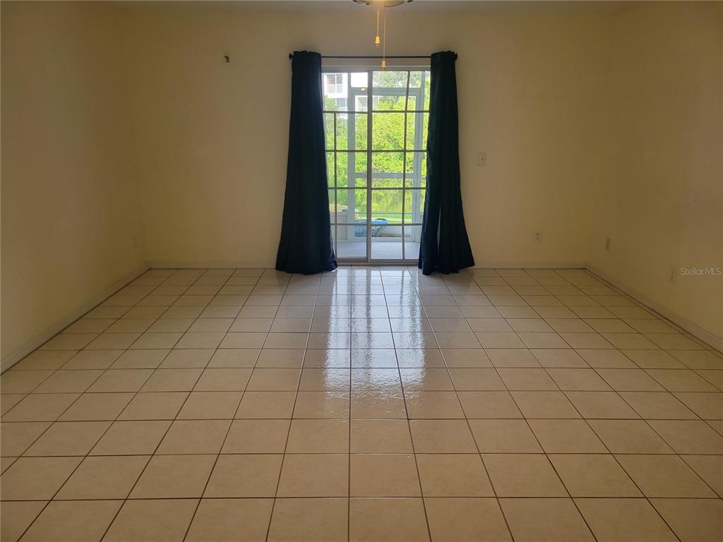 9976 Indian Key Trail, Unit 7 Seminole, FL 33776 - Photo 9 of 16 a view of an empty room and window