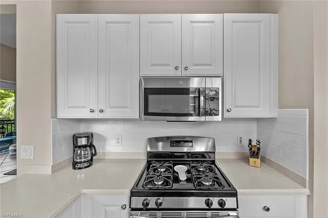 a kitchen with sink and window