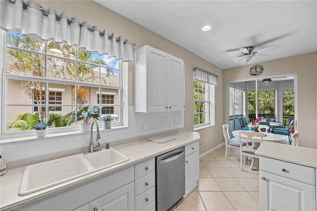 3975 Deer Crossing Court, Unit 201 Naples, FL 34114 - Photo 15 of 35 a kitchen with sink and window
