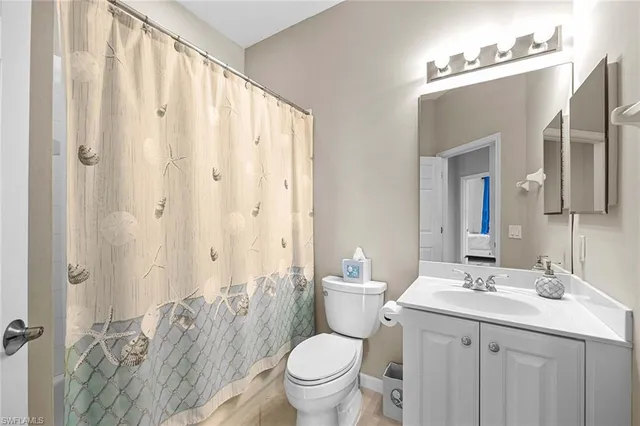 a bedroom with a bed and a lamp