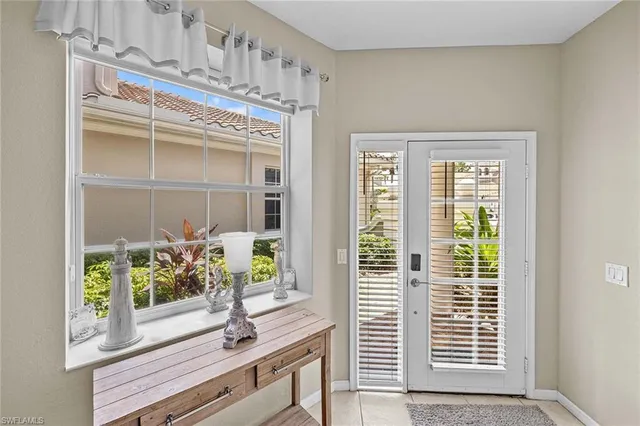 a view of a hallway with windows